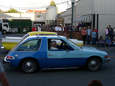 [A two-toned blue compact car with a rounded hatch.]